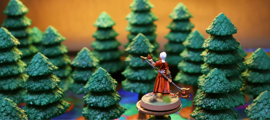 Player surveying the forested land from high in a tree.