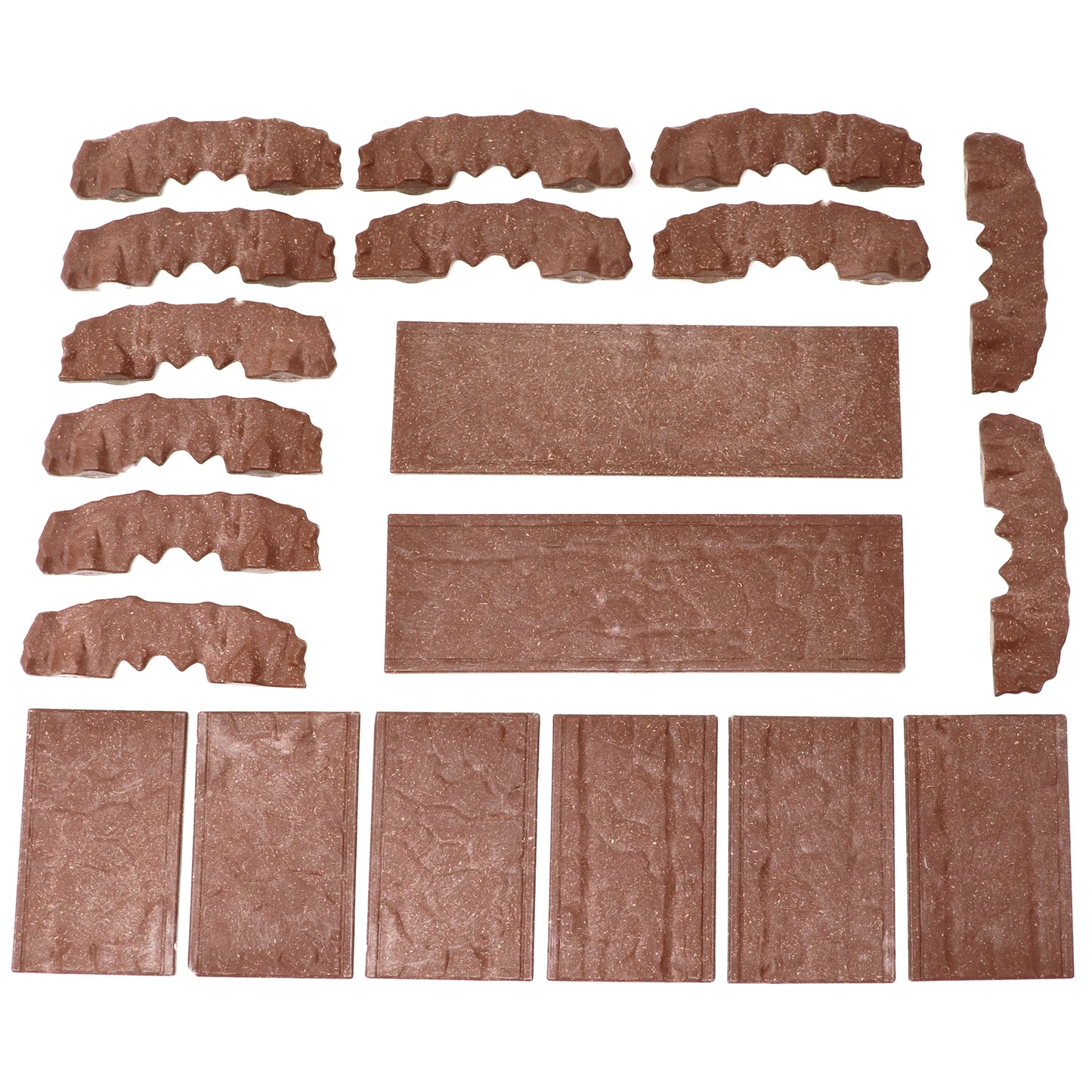 Overhead view of all the individual Rock Bridge walls and platform tiles laid out, showcasing the complete component parts of the kit.