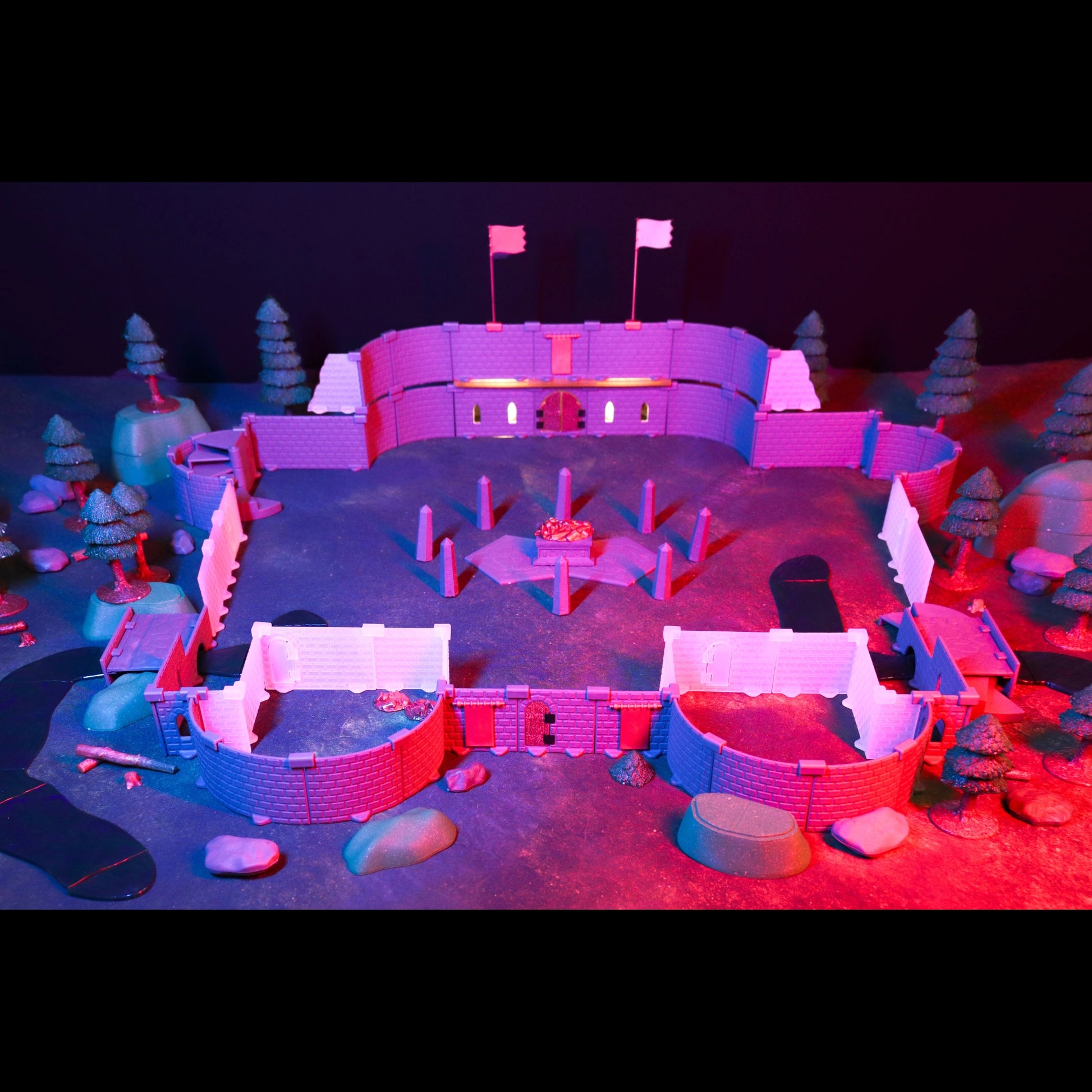 Atmospheric scene showing the terrain under dark red lighting, perfect for a spooky one-shot or undead lair encounter, with miniatures navigating the integrated forest and stone ruins.