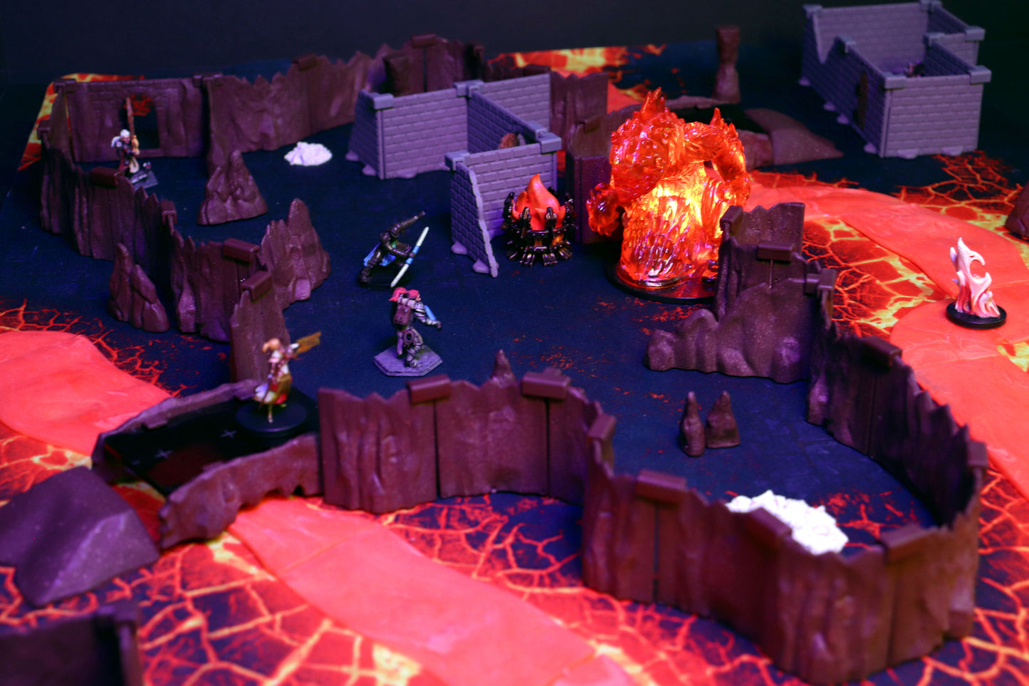 Detailed scene showing fantasy miniatures navigating a bridge crossing the translucent lava river in the Dragon's Lair Set, highlighting the danger and tactical element of the volcanic terrain.