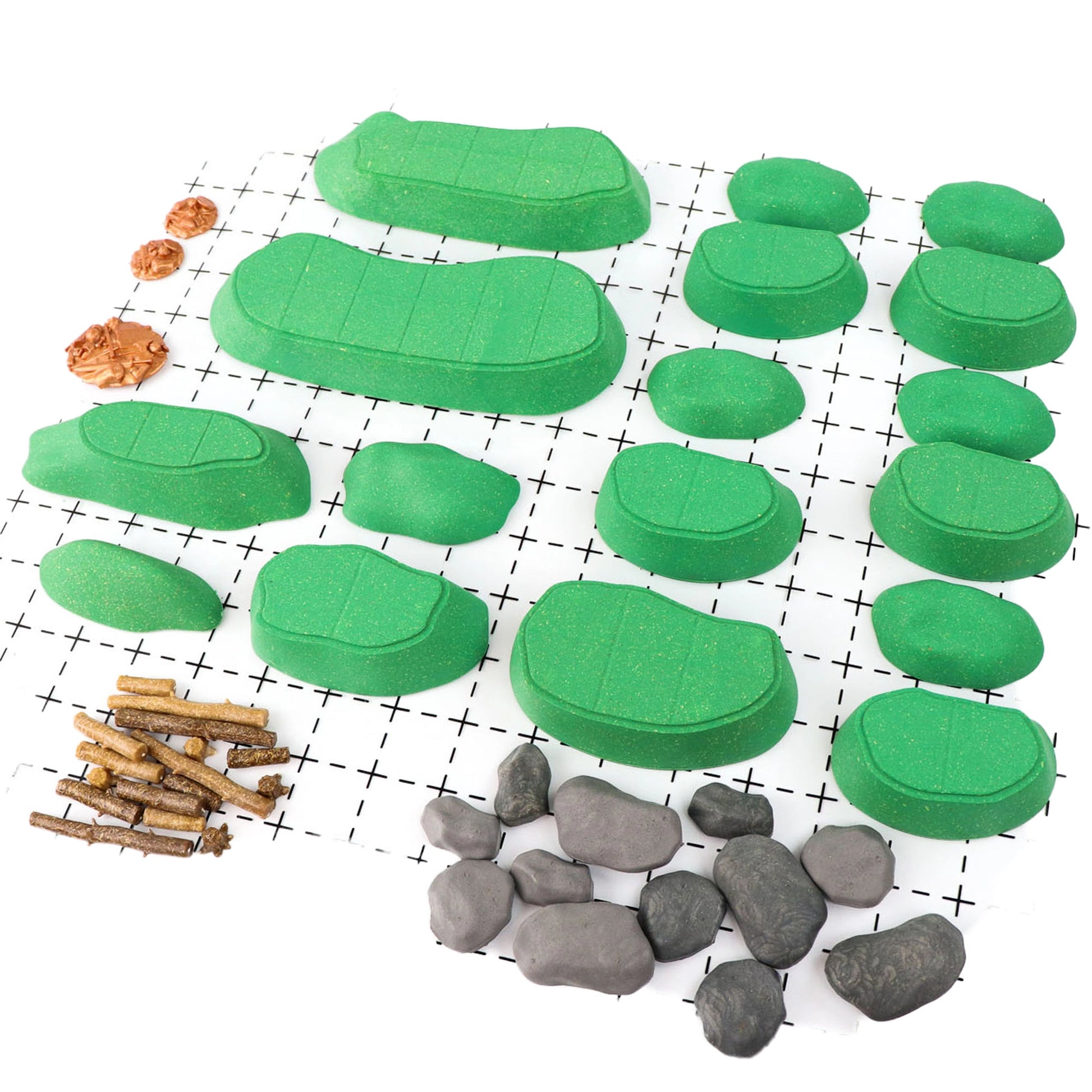 Clean, isolated view of all the unassembled pieces of the Gnoll Terrain Core Set on a white grid, including green modular hills, gray rocks, brown logs, and stumps. Shows all outdoor scatter terrain elements.