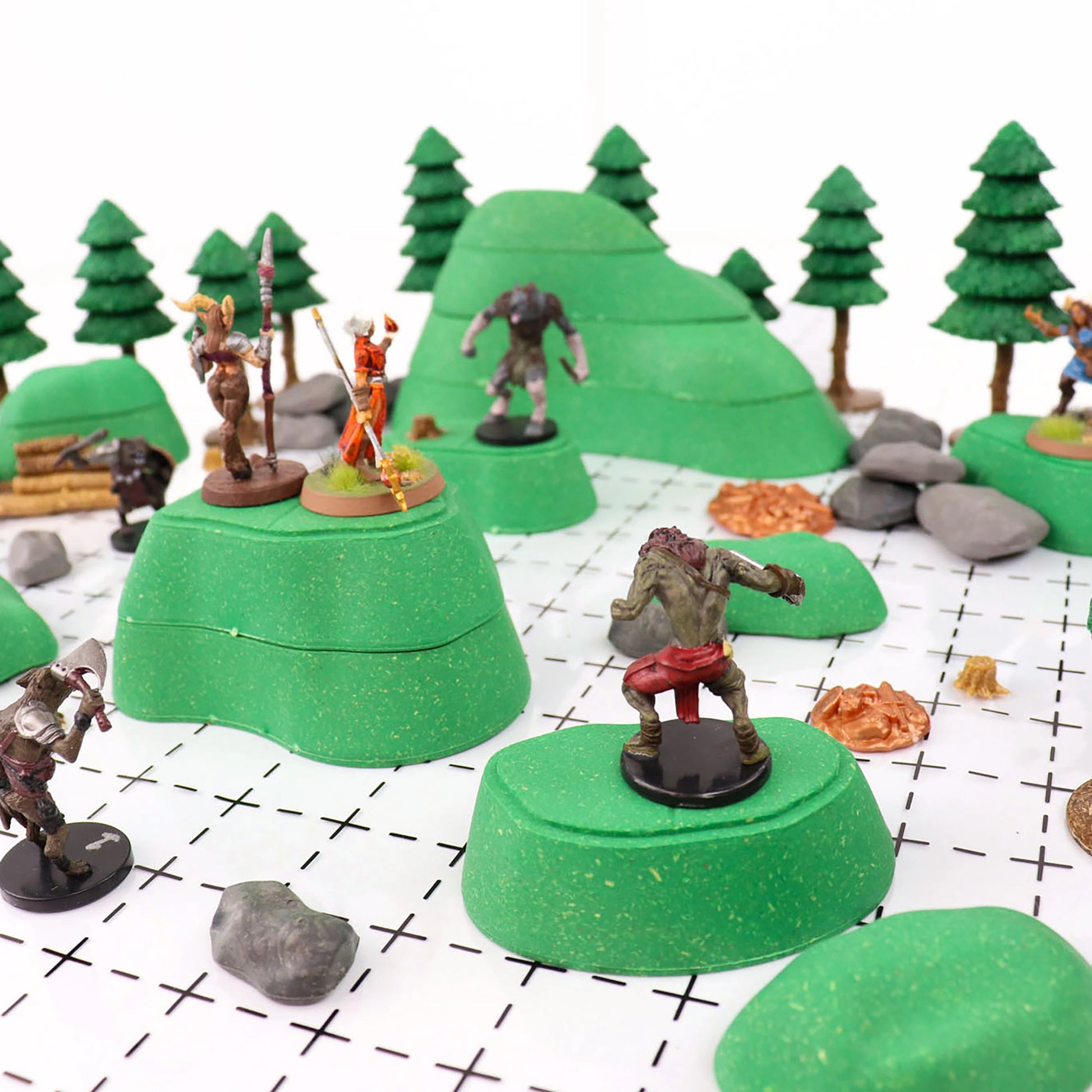A narrow shot of the battle between several Gnolls and several adventurers using the Gnoll Terrain set to get the high ground.  Various boulders and armor pile scatter litter the ground, and a Dark Pine Forest Kit can be seen in the background.