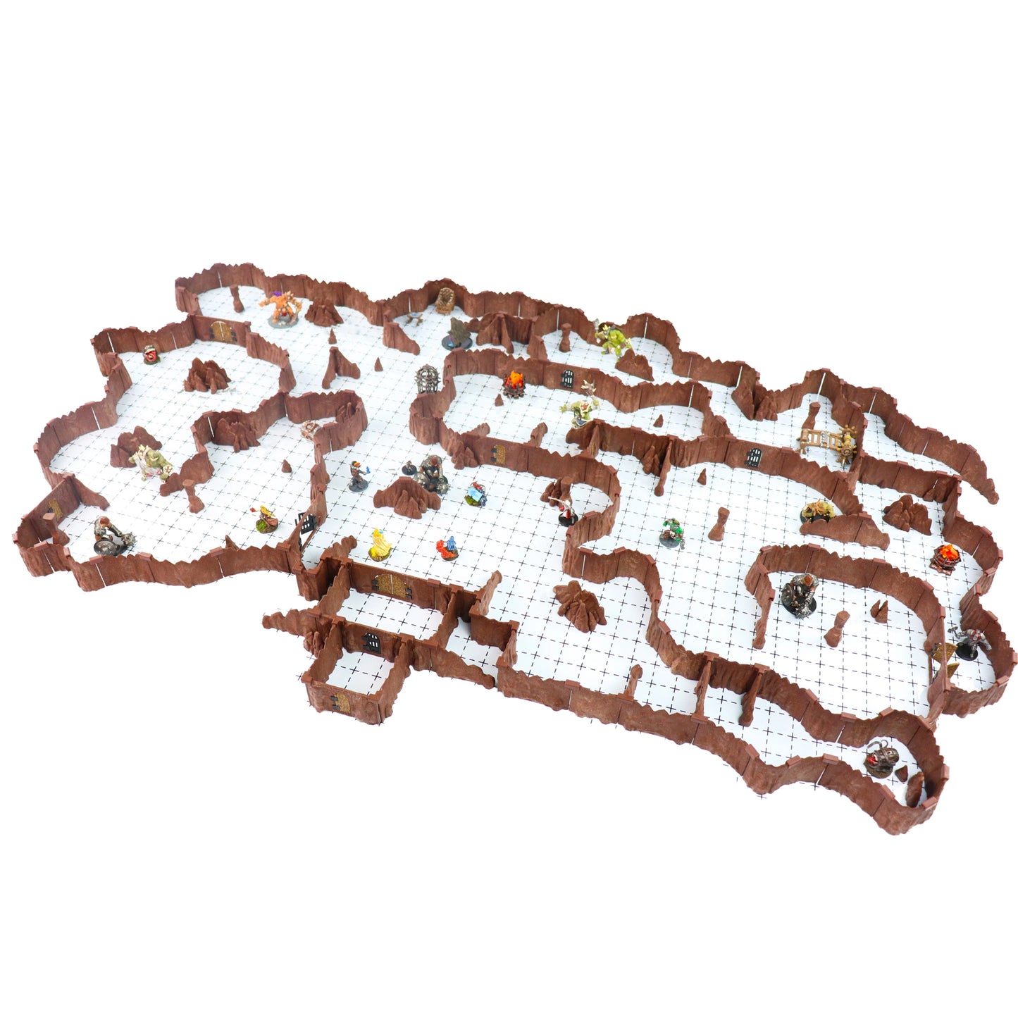 Isolated image of the immense, assembled Ogre Cavern Core Set modular terrain on a white background and grid, showcasing its sprawling size, brown rock walls, and deep customization for a tabletop RPG.