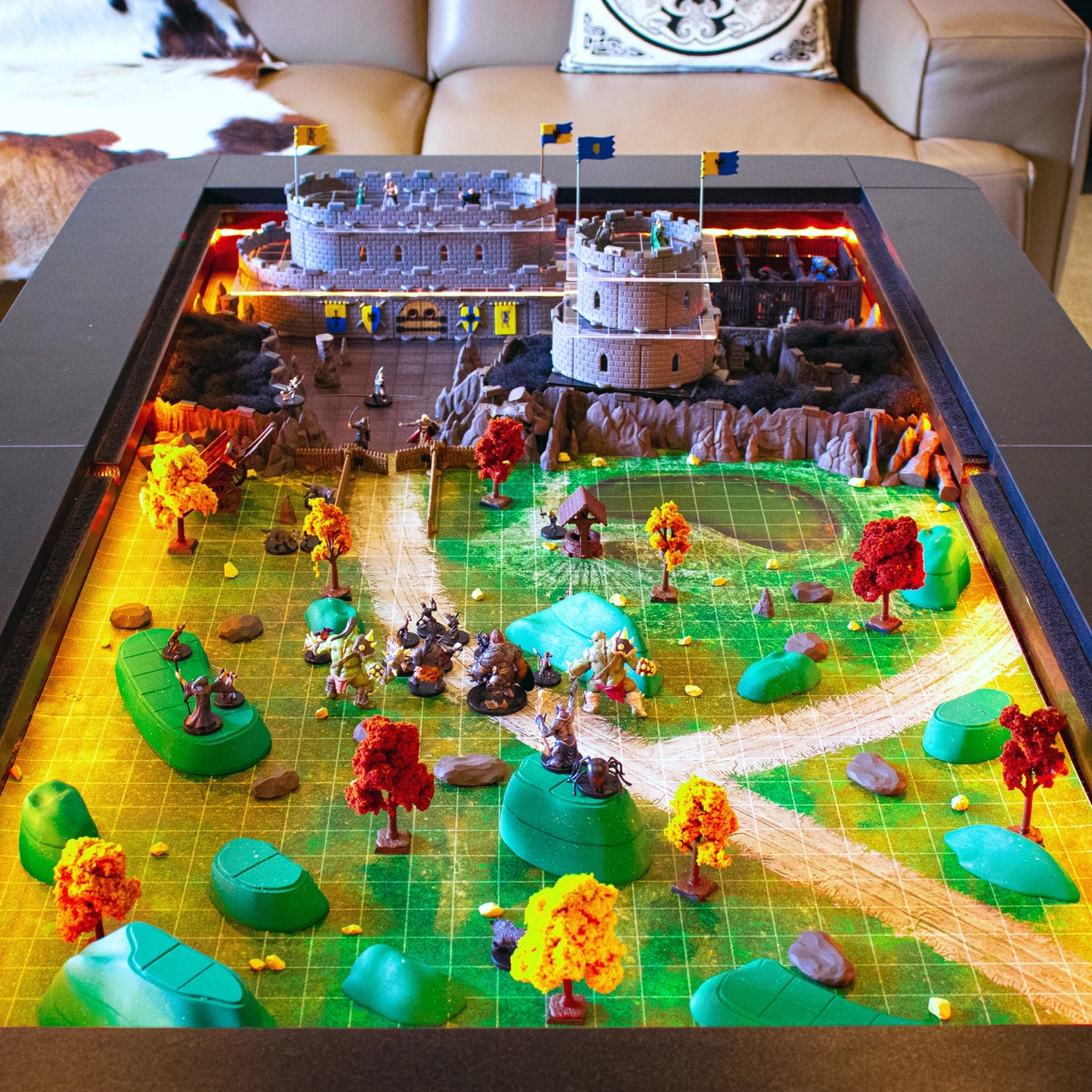 A dramatic scene showcasing the Owlbear Terrain Set (green hills) integrated with dungeon walls and cavern pieces, emphasizing its universal compatibility across your entire line of modular D&D terrain.