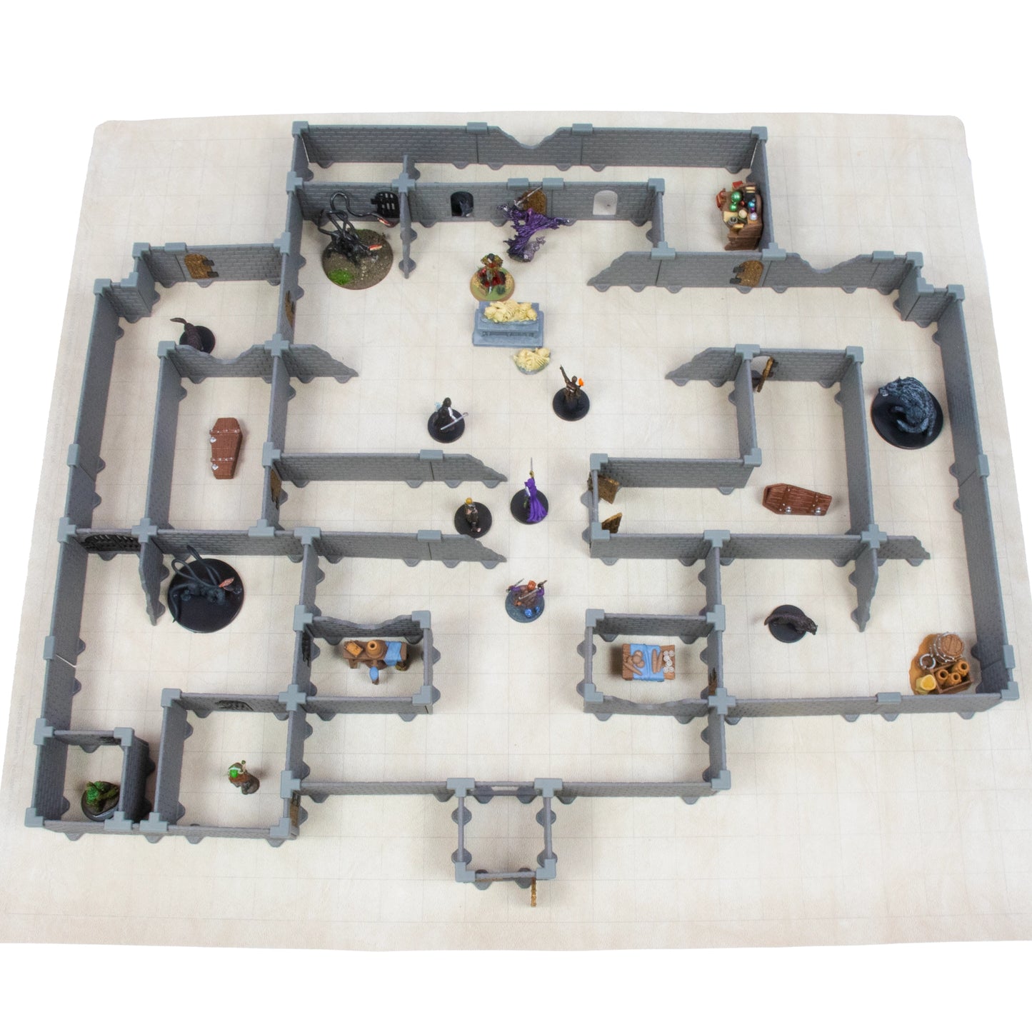 Bird's-eye view of the Rogue modular dungeon full set layout on a light-colored grid battle-map, featuring miniatures, chests, and terrain pieces arranged in a complex fantasy dungeon crawl scene.