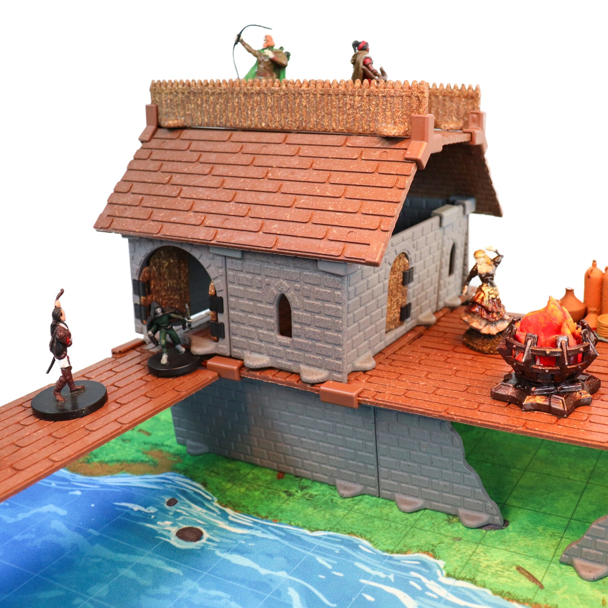 A complex battle scene set in the center of the modular village, featuring miniatures fighting near buildings created using the combined Rogue Set and Village Roofs Kit.