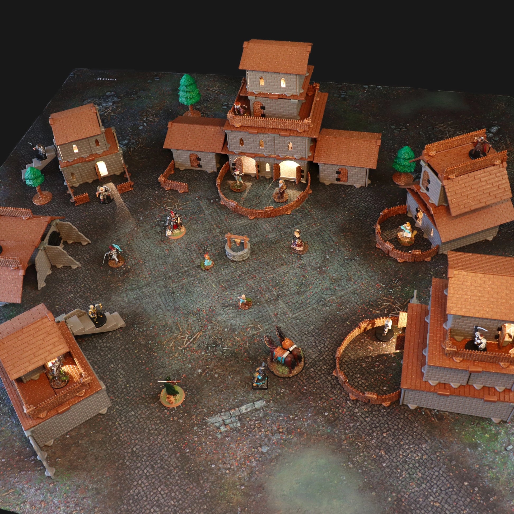 Atmospheric shot of a section of the village built as gothic ruins or a dark manor, using the modular walls and castle pieces with dramatic lighting for a spooky urban encounter.