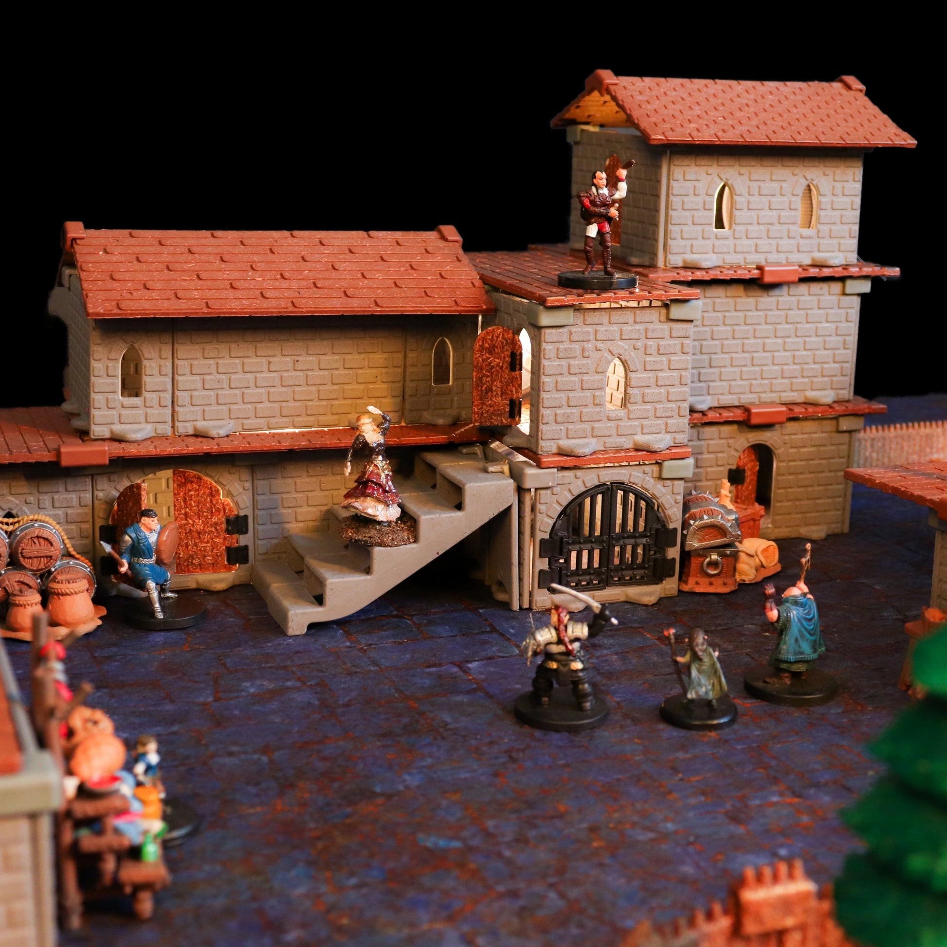Scene featuring the Village of the Lost Bundle configured as a fortified gatehouse and a small market area, demonstrating its utility in creating key focal points for a town or settlement defense.