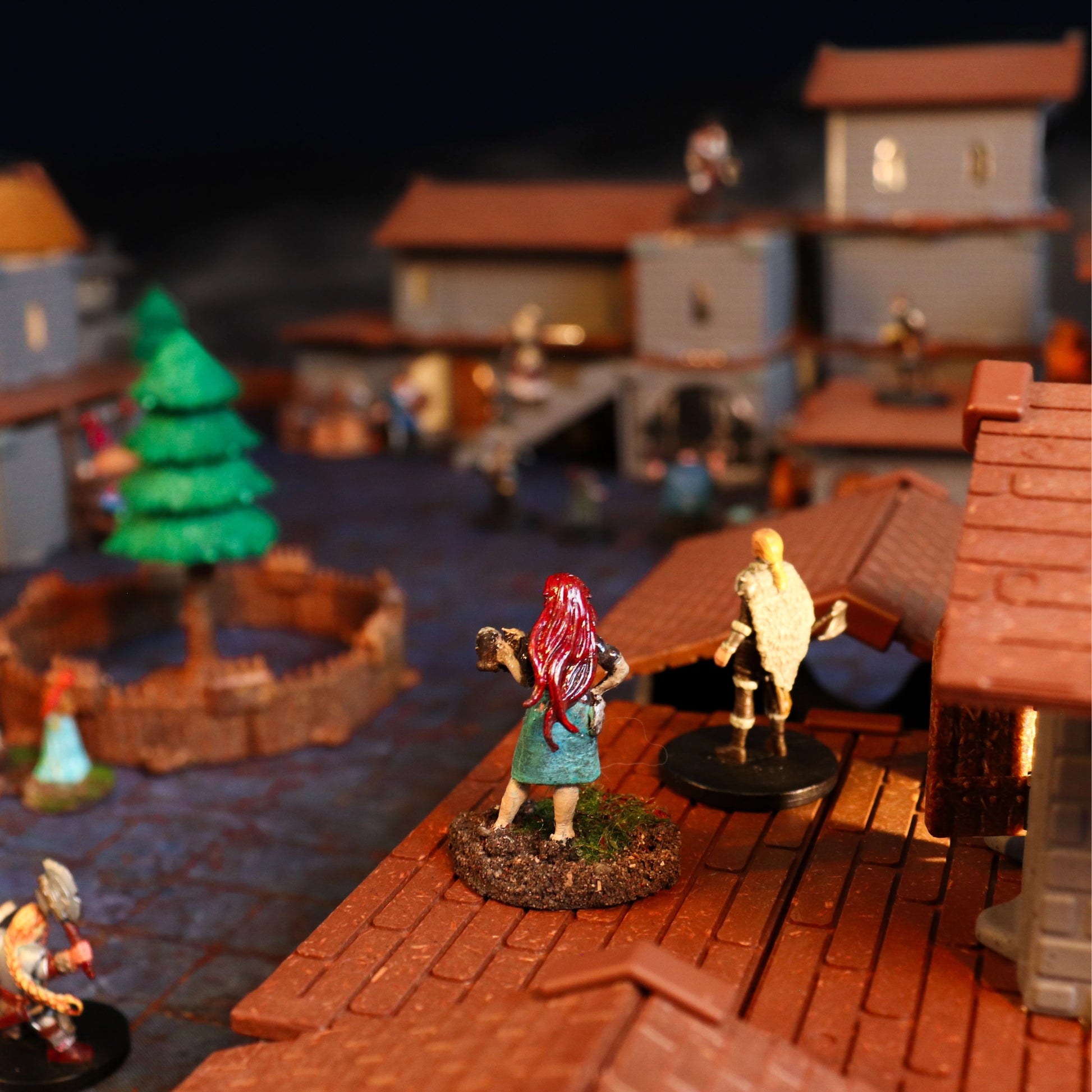 Close-up demonstrating the Village Roofs placed on the modular buildings, noting that the pieces can be flipped over and used as functional multi-story flooring for easy access and play.