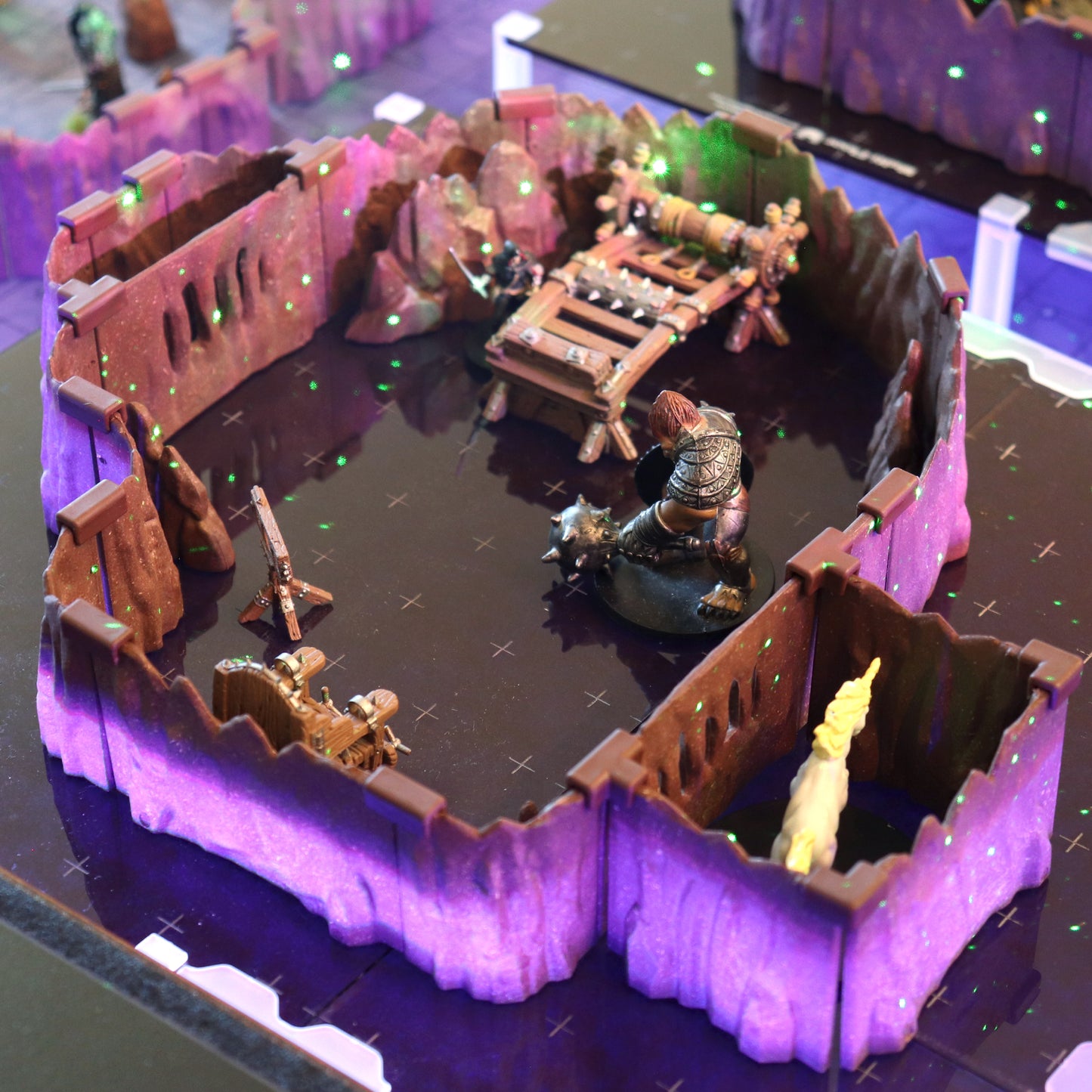Tabletop gaming scene showing the Special Cavern Walls Expansion set up as an enclosed arena for a TTRPG encounter with a monster miniature.