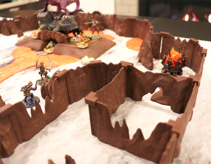 A large setup utilizing the modular Special Cavern Walls to create winding passages, featuring two archer miniatures and a miniature fire pit.