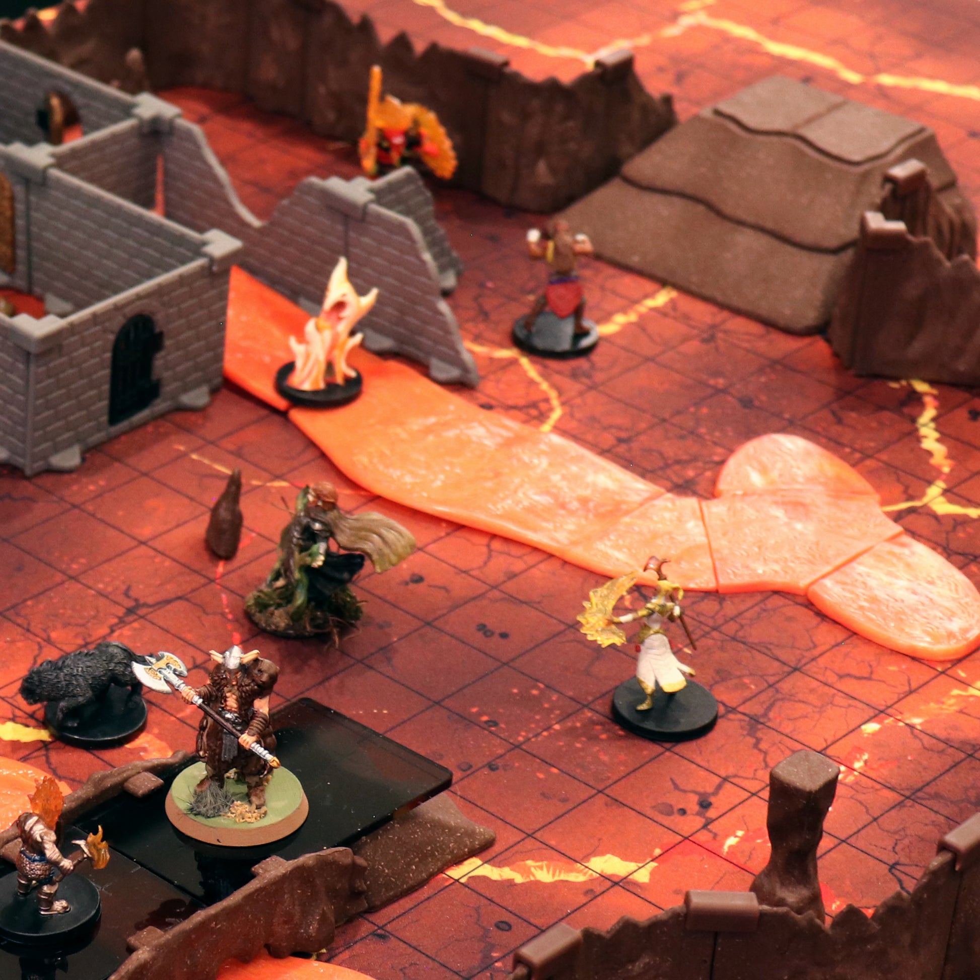 Overview of a cavern map showing Dirt Ramps blending with terrain tiles, providing elevation for miniatures in a fantasy battle scene.