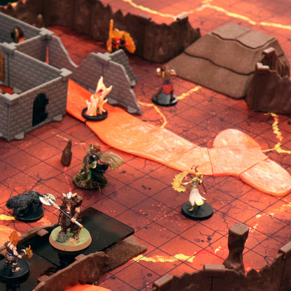 Overview of a cavern map showing Dirt Ramps blending with terrain tiles, providing elevation for miniatures in a fantasy battle scene.