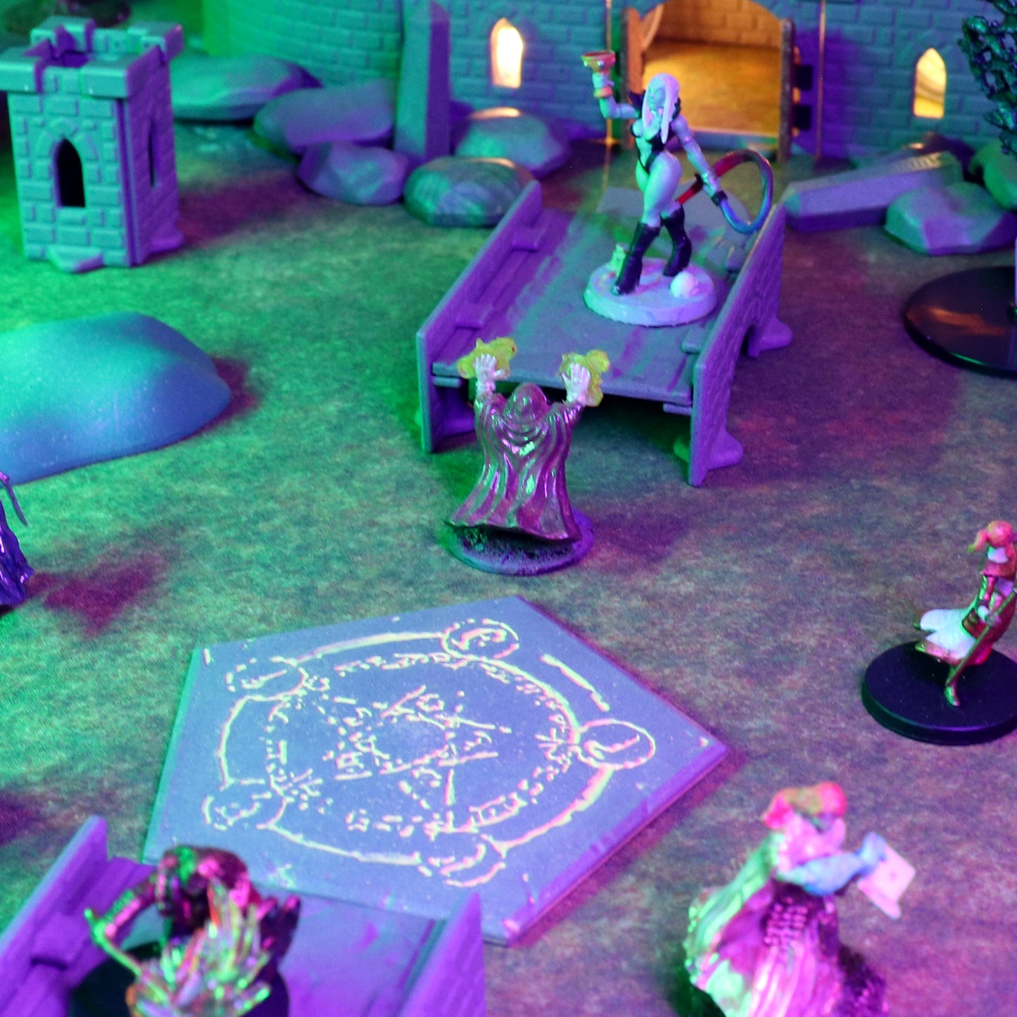 TTRPG battle scene showing a miniature wizard casting a spell over a glowing Summoning Circle platform with other heroes and castle terrain in the background.