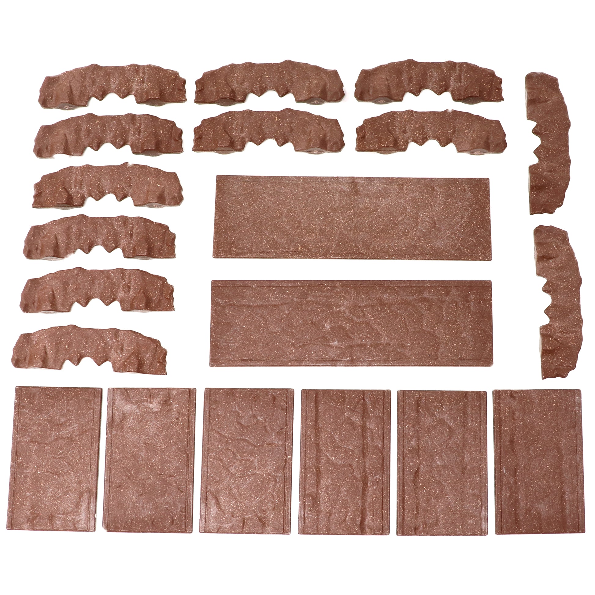 Overhead view of all the individual Rock Bridge walls and platform tiles laid out, showcasing the complete component parts of the kit.