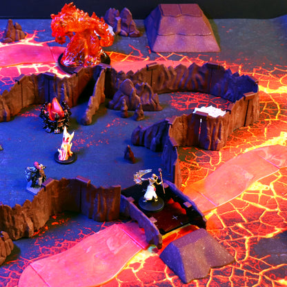Dramatic TTRPG setup showing a character miniature crossing a Rock Bridge over a vibrant lava chasm, surrounded by cavern walls and a fire elemental monster.