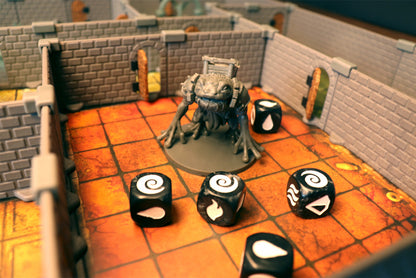 Close-up of a large boss monster miniature from AltarQuest inside a dungeon room built with the AQ Set modular walls, surrounded by custom dice.