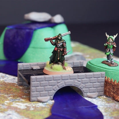 Close-up of a bandit or player entering the bandit camp by crossing a bridge over water with a waterfall in the background.  
