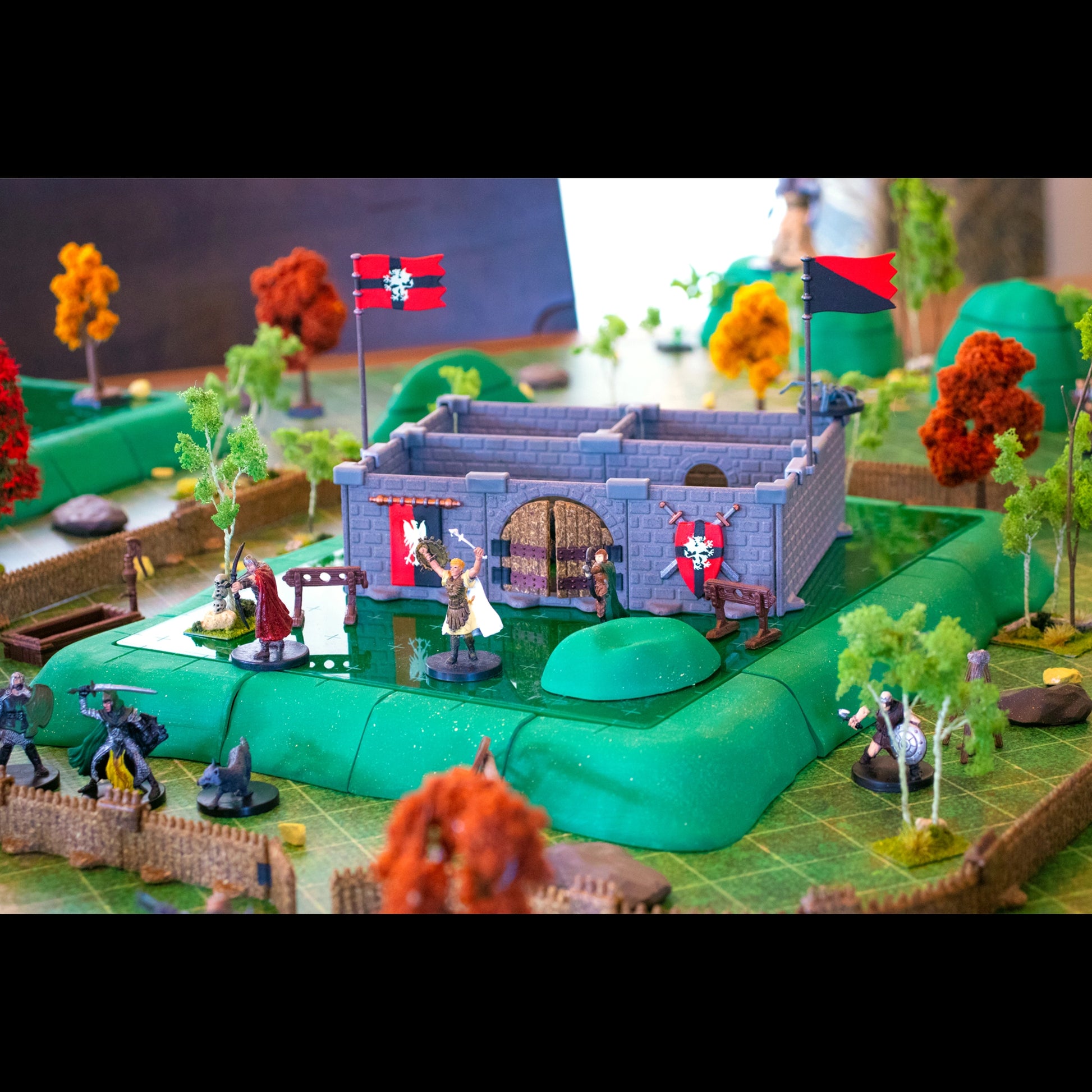 Overhead view of the ruins WITH Castle Decor Expansion and palisade scatter terrain from the Chimera Set laid out on a grid battle-map, showing the placement accuracy for tabletop RPG combat and movement.