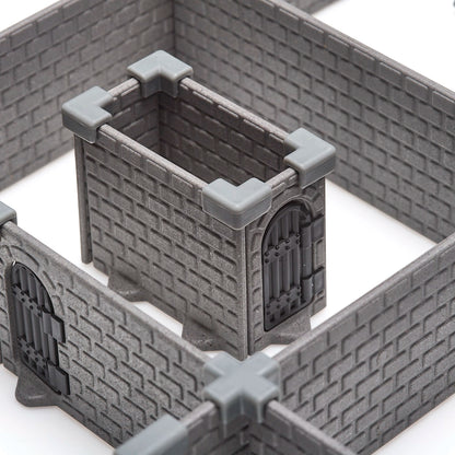 Extreme close-up of a small, contained wall section from the modular dungeon system, clearly showing the dark grey injection-molded brick texture and the grey, corner wall clips for a secure assembly.