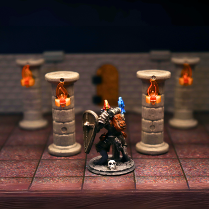 Painted knight miniature with a shield, posed in a dungeon setting with stone pillars and warm torches in the background.