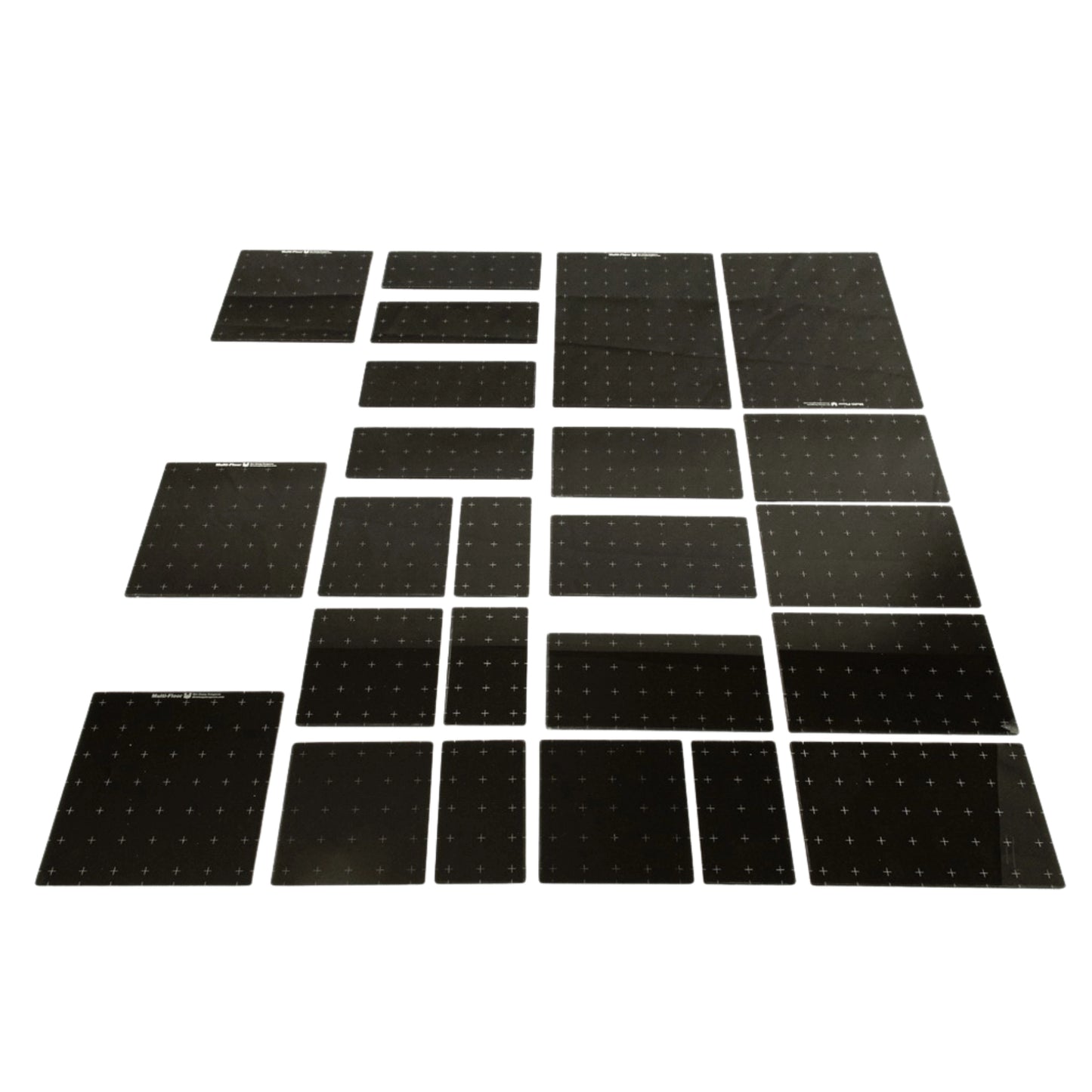 Set of dark gray acrylic platforms on a white background showing the various sizes included in this set. 