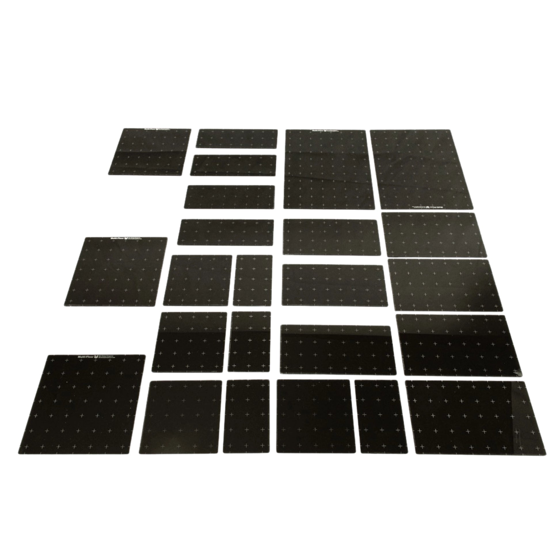 Set of dark gray acrylic platforms on a white background showing the various sizes included in this set. 