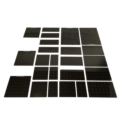 Set of dark gray acrylic platforms on a white background showing the various sizes included in this set. 