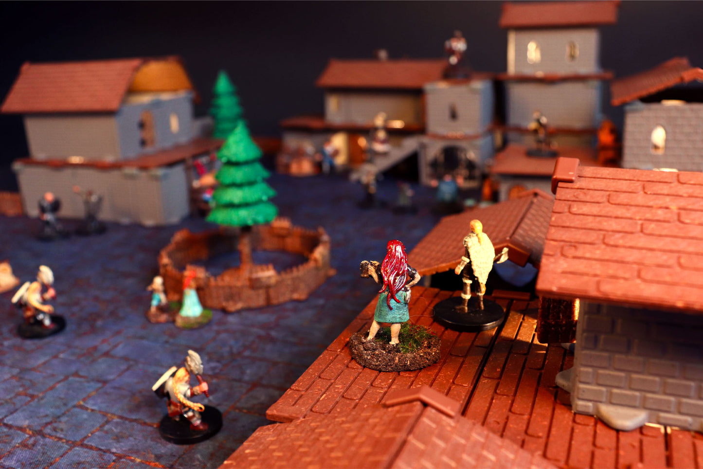Miniature standing on a brown Village Roof tile, providing a high-ground view over the 3D village terrain battle scene.