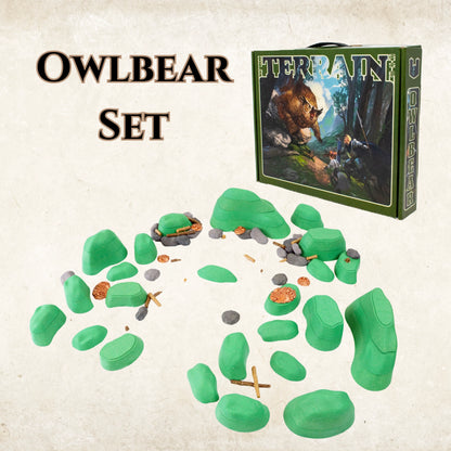 Image showing the Owlbear Terrain Core Set product box next to a larger assembled layout of green modular hills, rocks, and logs. This mid-range set is perfect for creating expansive outdoor D&D terrain and battlefields.