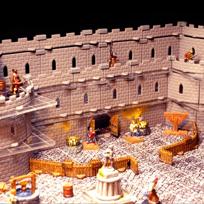 Detailed scene showcasing the Regent Castle Set configured with a large central courtyard and an imposing gatehouse section, featuring windowed walls and miniatures for a tabletop RPG entry point.