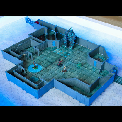 Wide view of a combat scene built using the Rogue set and diagonal wall pieces from the Diagonal Wall Expansion, featuring a large golem miniature and adventurer miniatures on a blue battle map under bright lighting.
