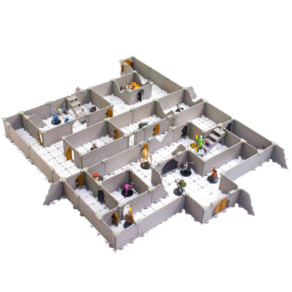 Overhead view of the fully assembled Rogue modular dungeon full set with multiple rooms, corridors, and doorways, featuring several painted fantasy miniatures on a white grid mat, ideal for tabletop RPG combat.
