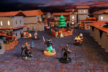 Tabletop RPG miniatures on a village street, surrounded by 3D buildings topped with brown Village Roof Kit pieces under dramatic twilight lighting.