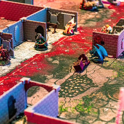 Detailed close-up shot of the Squire modular dungeon walls in an immersive tabletop RPG battle scene, featuring a red-and-white cracked battlemap, a dragon miniature, and other painted character miniatures.