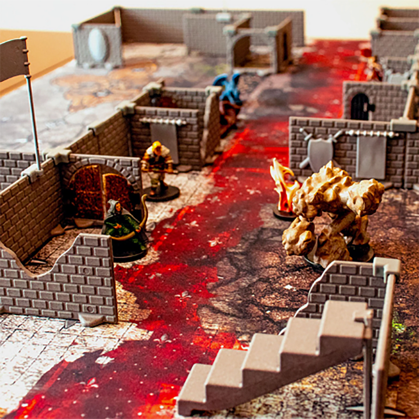 Action-packed scene of the Squire modular terrain set up on a high-detail battlemap, featuring a stair piece, damaged walls, open doorways, and multiple miniatures engaged in combat for a D&D or tabletop RPG session.