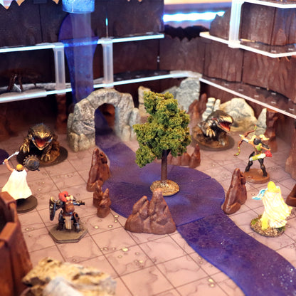 A large, winding river and waterfall created using the Waterways Kit modular sections, featuring 3D water effects and an island terrain piece for tabletop RPGs.