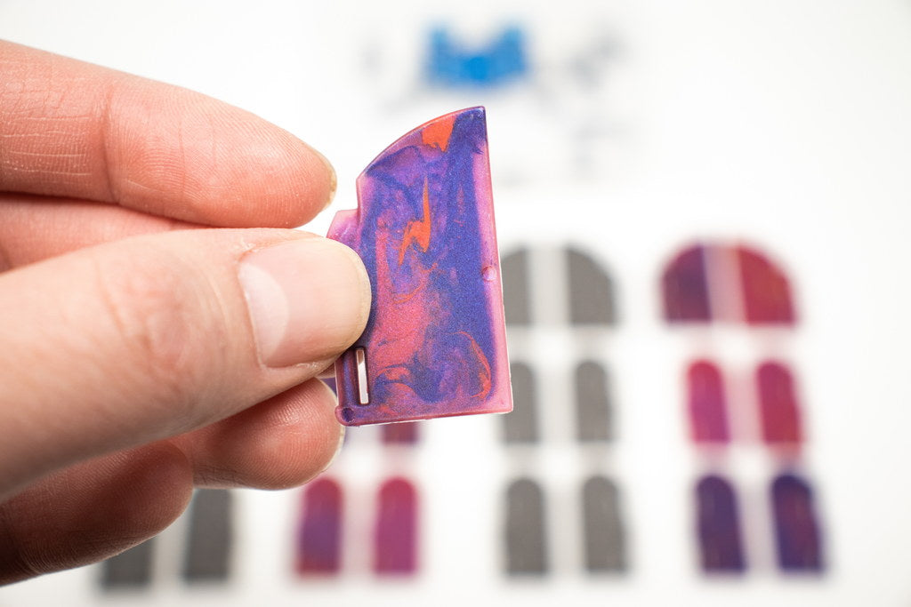 Close-up of the swirled translucent Magic Door pieces (single door) for TTRPG dungeon fantasy terrain.